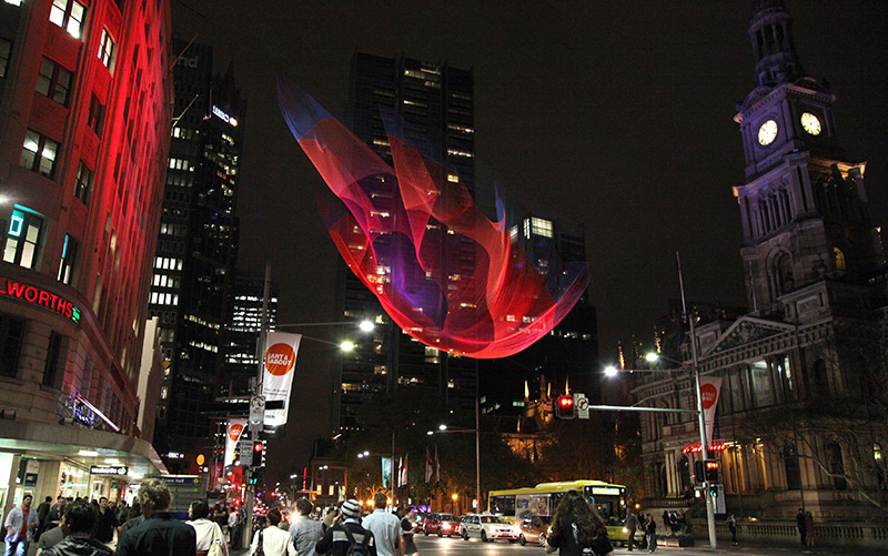 Illustration for article titled Artists creates awesome artificial glowing nebulae over city skies